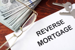 Reverse mortgage form on a table and money.